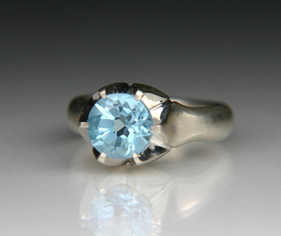 Lotus ring in silver set with a 9mm Sky Blue Topaz