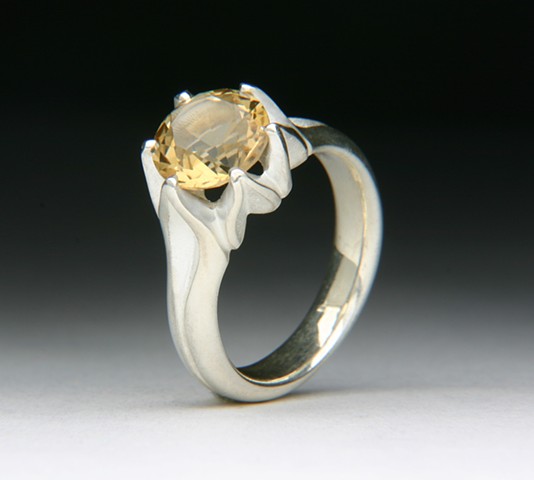 THE FULL LOTUS IS A DESIGN TWIST ON THE LOTUS RING. THE MOUTNING IS DE-OX SILVER THAT DOESN'T TARNISH LIKE STERLING SILVER. SET WITH AN AMAZING UNTREATED NATURAL YELLOW CITRINE. 