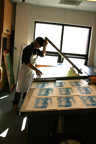 Devan Burry printing his four-colour silkscreen