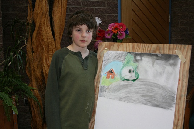 Young draftsman with his work