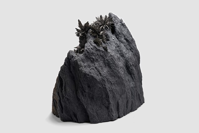Gravity-bursts in rock sculpture Aeolian Dust. Size: 55 x 40 x 35cm