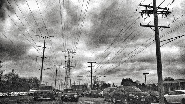 Parking, Power Lines, and Storm Clouds