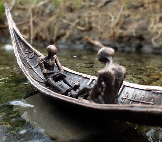 2 figures in a boat