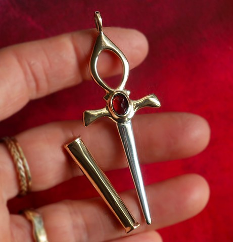 Gold and silver dagger ankh pendant with blood red garnet center. Custom Ankh Dagger.
