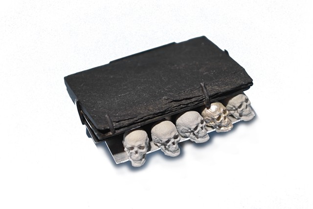 brooch, skulls