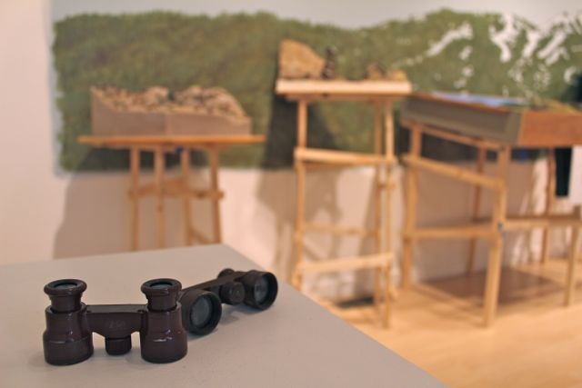 Vintage binoculars with the found dioramas & their supports in the background