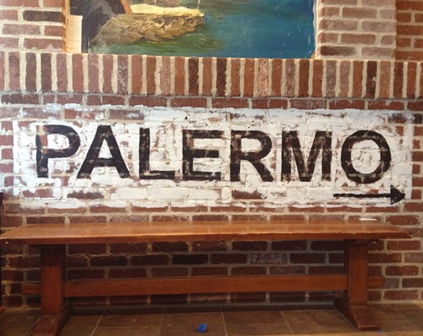 Hand painted "Palermo" on brick
