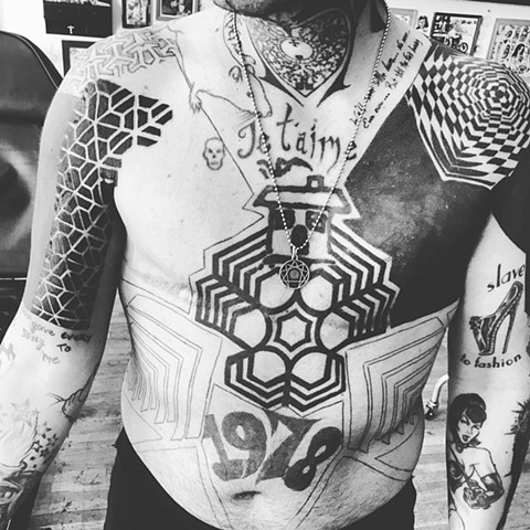 blackwork geometric body suit tattoo