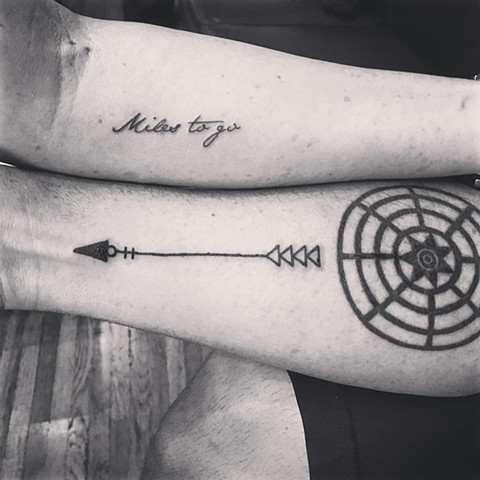 arrow tattoo with lettering