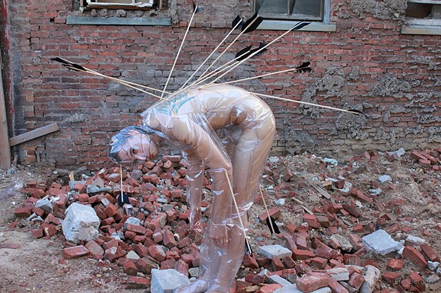 Plastic costume with arrows covering all skin, for "Dragging me through the Dirt" performance. 