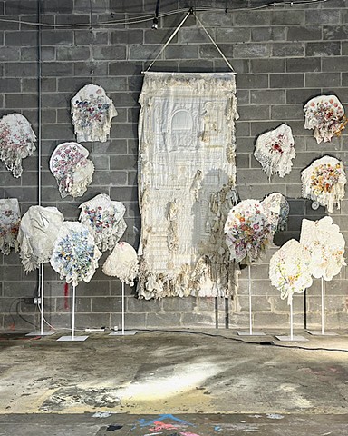 Blooms and Mending Tapestry in studio
