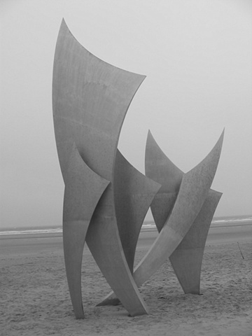d day sculpture on beach abstract