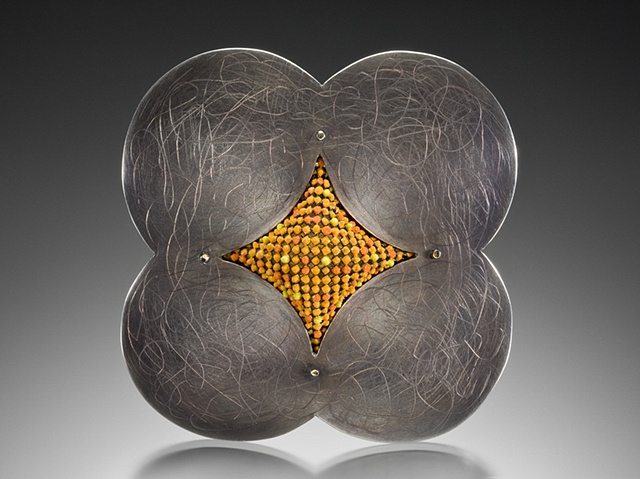Contemporary art jewelry brooch of sterling silver by Wendy McAllister.