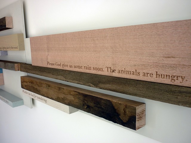 A sculptural wall relief featuring laser engraved timber