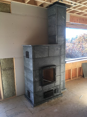 A soapstone heater by Greenstone Heat