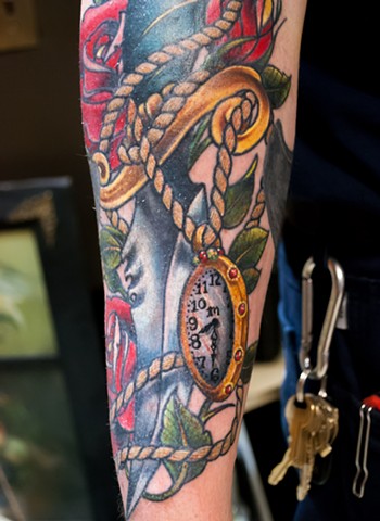 detail of traditional inspired dagger rose and watch tattoo by chris lowe of naked art