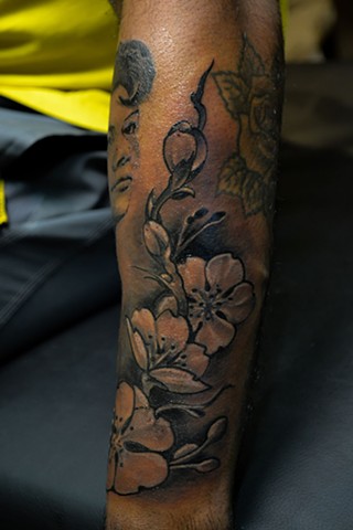 cherry blossom tattoo on arm by chris lowe of naked art tattoos odenton maryland