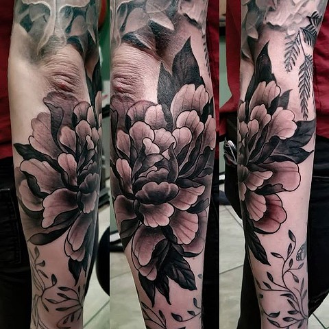 Flower tattoo by Chris Lowe at naked art tattoos in Odenton Maryland