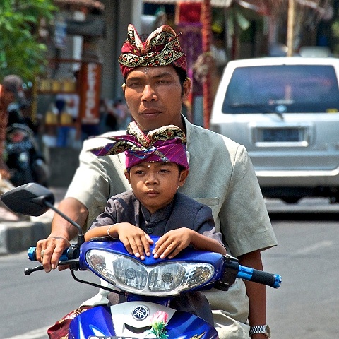 Father and Son on motorcycle in Bali