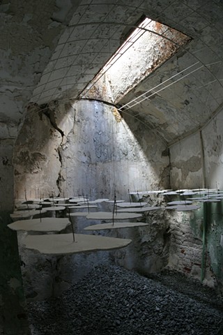 Image of Juxtaposition installation by Matthew Stemler artist at Eastern State Penitentiary, abstract sculpture, plaster, stone, wood, steel