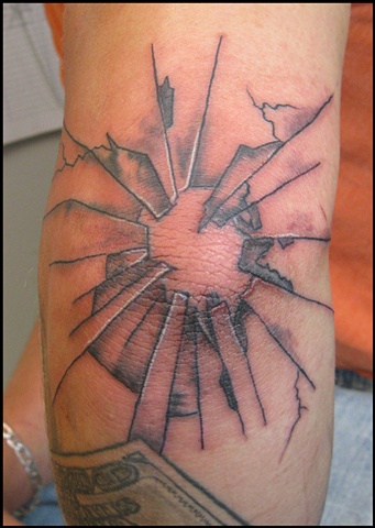 glass bullet hole tattoo