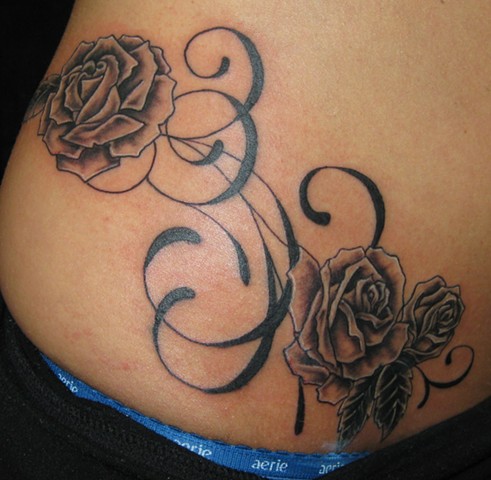 Roses and swirly stuff on hip