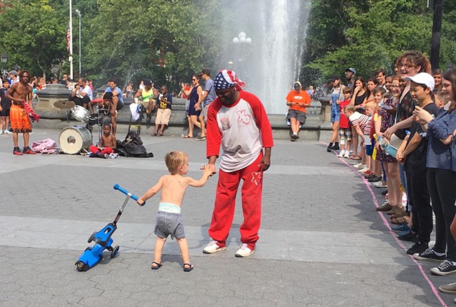 A Child Offers a Hand