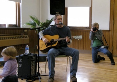 Guitarist performing at Clifton Cultural Arts Center