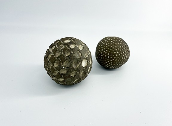 Two Small Textured Spheres