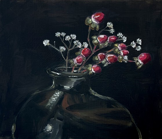 Dark and moody still life, painting, red berries and white flowers in a hand blown glass jug