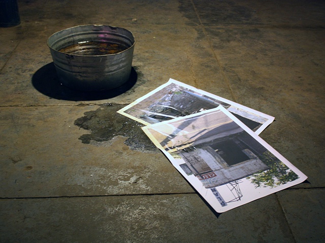 sculpture of photograph in artificial puddle by Rena Leinberger