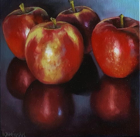 Four Reflective Apples