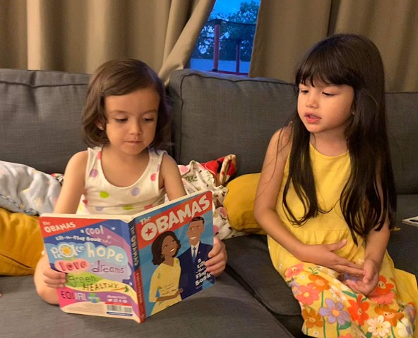 Sophia and Isabelle with "The Obamas: A Lift-the-Flap Book"