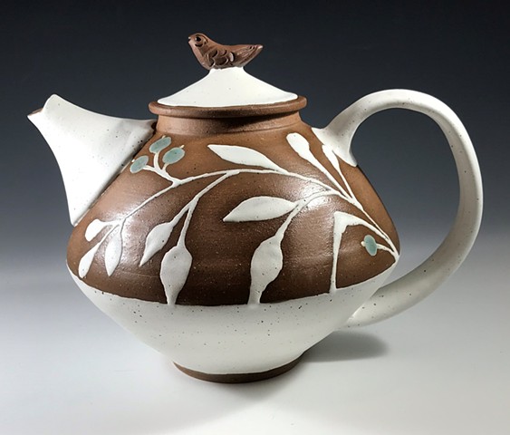 White Teapot with a bird on top