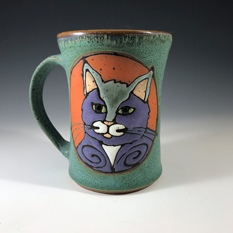 Other side of mug with purple and green cat