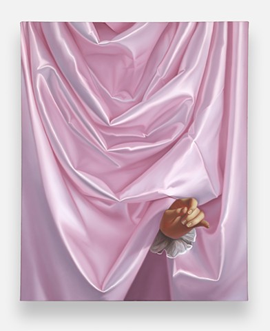 Hand of A Boy In Pink Satin Fabric