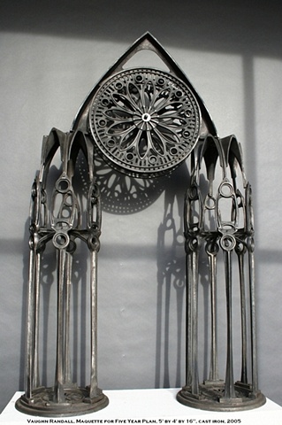 Intricate cast iron sculpture of a Gothic cathedral with a rosary window fly wheel in the attic  by Vaughn Randall