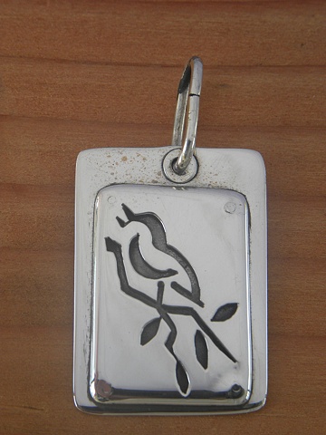 sterling silver pierced bird pendant