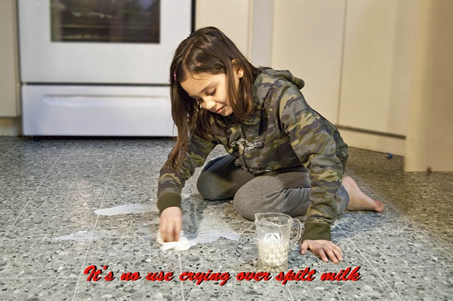 Girl cleaning up spilt milk