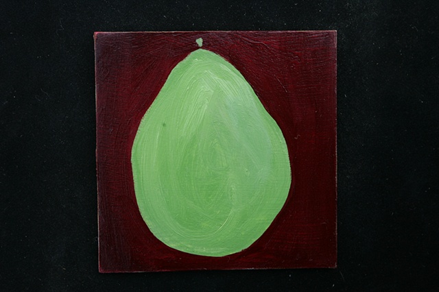green pear on red