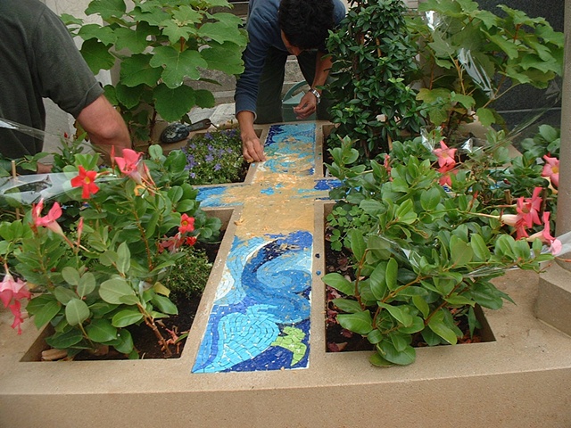 Removing the paper from the mosaics.