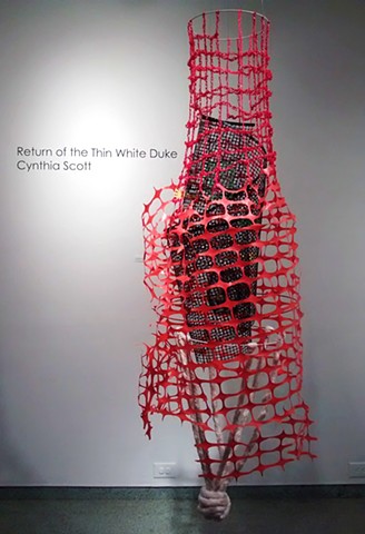 Mixed media suspended sculpture about institutional racism and incarceration