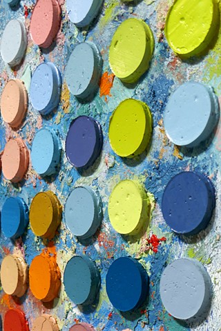A detail of the painting by Daniel Atyim titled The Dance, oil on panel, 16 × 20 inches. Richly colored, abstract painting with repeated raised circular forms of oil paint over rough textured surface made primarily of blue hue and tone..