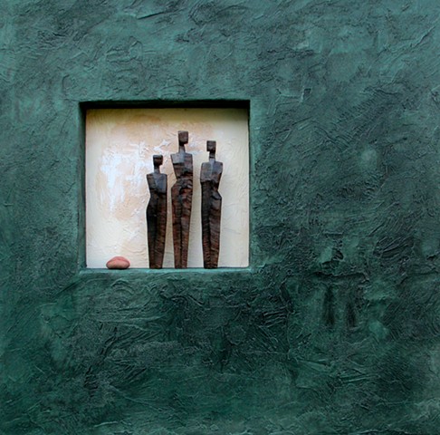 Three Figures with stone