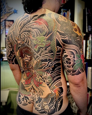 Right side view of a traditional Japanese back piece with a Samurai and green dragon.