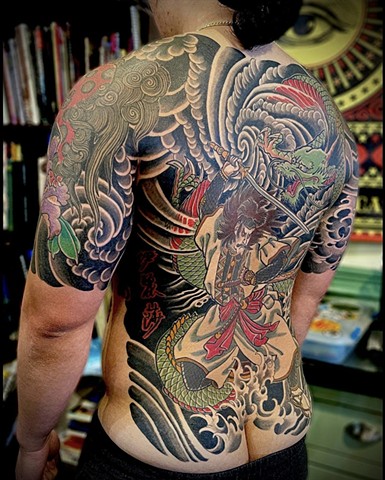 The left view of a traditional Japanese back piece, featuring a samurai and green dragon