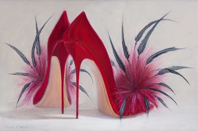 Red shoes with black spiky feathers and red puffs.