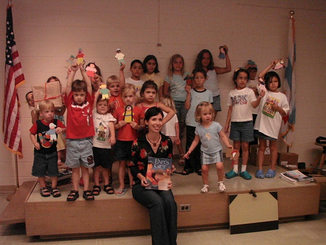 Rene and the kids with their beautiful paper dolls at the end of a fun library visit.