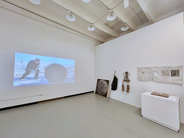 Â¡DARN! 2025 installation view with object components and projected video