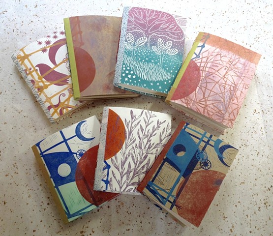 colorful handmade sketchbooks using linocut and printmaking covers